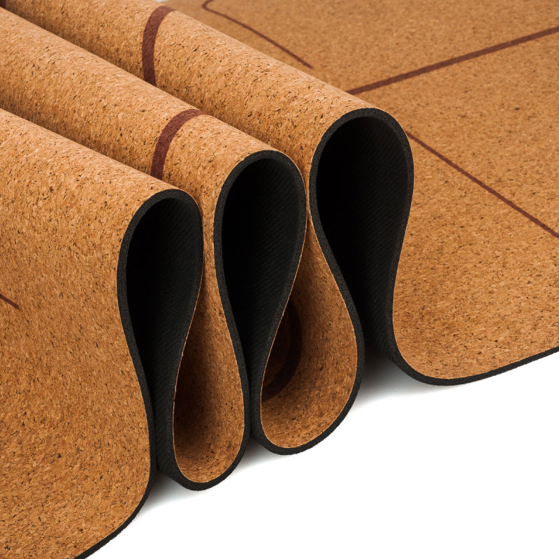 Flexible cork yoga mat shown partially curled.