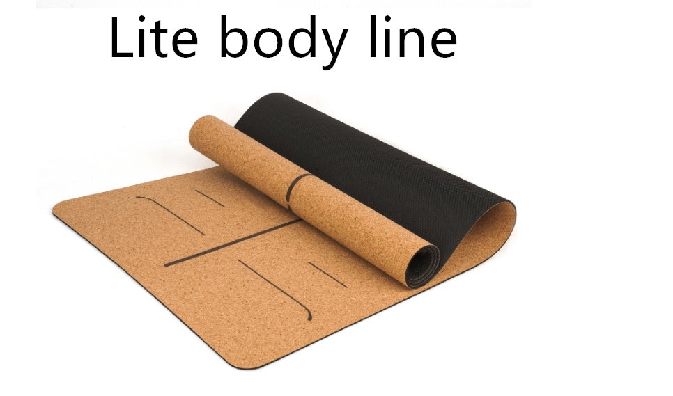 Cork yoga mat with alignment lines shown partly rolled.