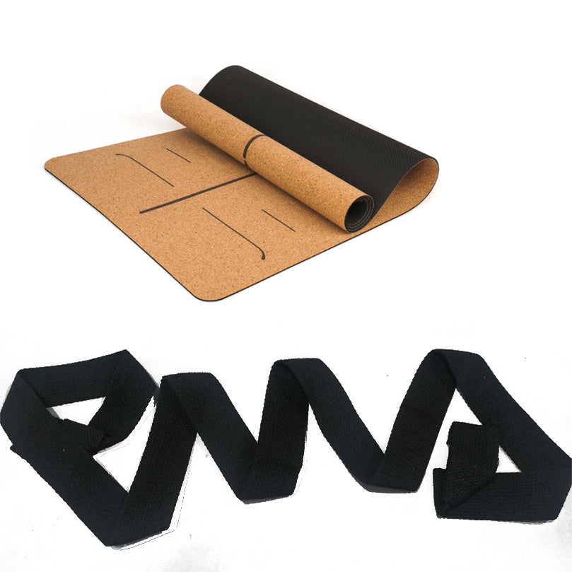 Alignment-line cork yoga mat shown with a black carrying strap.