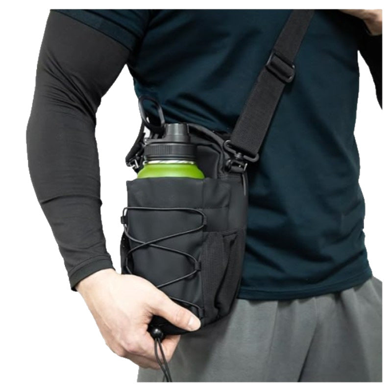 Black gym bottle bag worn across the body with its shoulder strap.