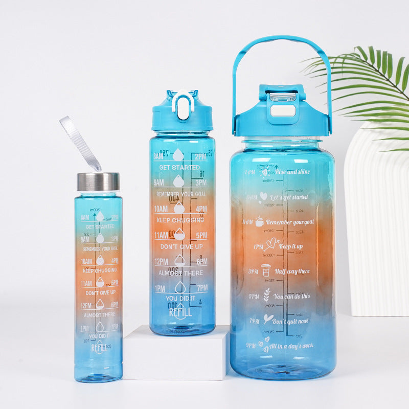 Three blue and orange gradient sports water bottles in different sizes
